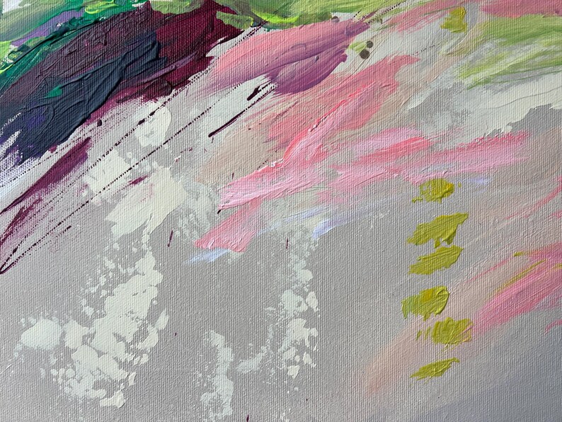 May include: Abstract painting with a textured canvas. The artwork features diagonal brushstrokes in shades of pink, green, purple, and white against a gray background. Splatters of white and yellow add visual interest to the piece.