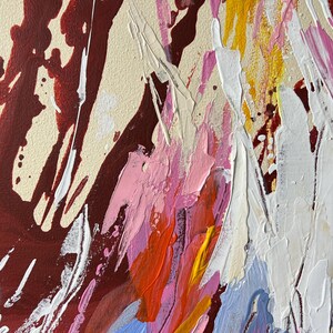 May include: Abstract painting with thick brushstrokes in shades of red, white, pink, yellow, and blue. The artwork features a textured surface with visible paint layers and a cream-colored background. The style is expressive and modern.