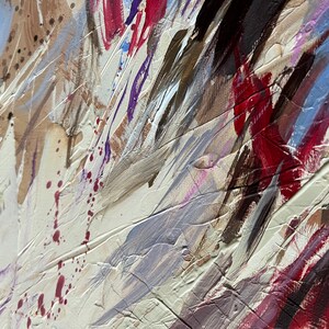 May include: Abstract painting with thick brushstrokes in shades of beige, white, red, blue, and purple. The artwork features textured layers and splatters, creating a dynamic and expressive composition. The painting's style is modern and contemporary.