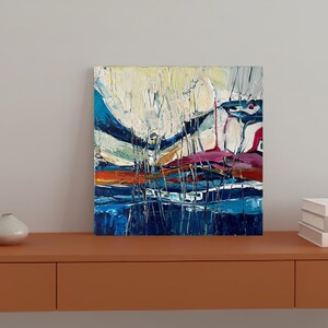May include: Abstract oil painting on canvas with a textured, impasto style. The artwork features a vibrant color palette of blues, white, orange, and pink. The composition includes vertical and horizontal brushstrokes, creating a dynamic landscape.