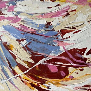 May include: Abstract painting with thick brushstrokes in shades of white, pink, blue, yellow, and burgundy. The artwork features a textured surface with visible paint layers, creating a dynamic and expressive composition. The painting's style is modern and contemporary.