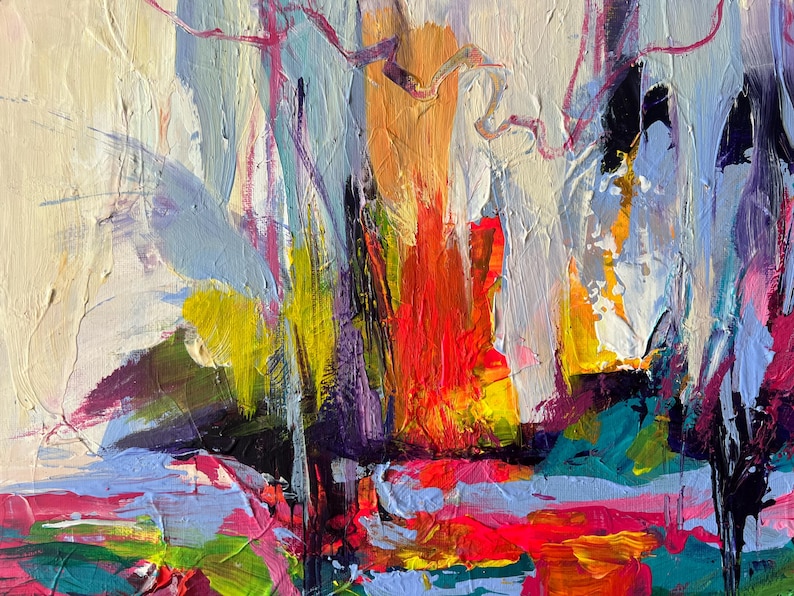 May include: Abstract painting with thick brushstrokes in a variety of colors. The artwork features a central orange and red area, surrounded by yellow, purple, blue, and pink hues. The background is a creamy white.