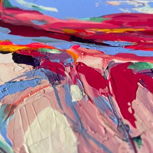 May include: Abstract painting with thick brushstrokes in shades of pink, red, blue, and yellow. The artwork features a textured surface, with visible paint layers creating a dynamic and colorful composition. The style is expressive and modern.