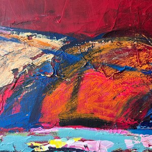 May include: Abstract painting with a textured surface. The artwork features a vibrant mix of colors, including red, orange, blue, and yellow. The brushstrokes create a sense of depth and movement, with a focus on the interplay of light and shadow.