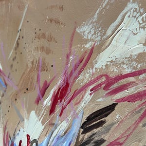 May include: Abstract painting with a tan background and bold brushstrokes in white, red, and black. The artwork features a textured surface with visible paint layers and splatters, creating a dynamic and expressive composition.