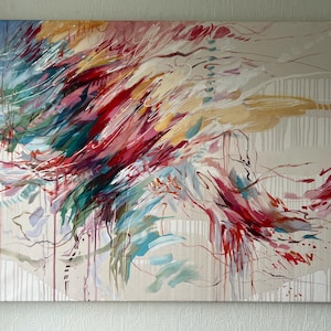 May include: Abstract painting on canvas with a beige background. The artwork features dynamic brushstrokes in shades of red, teal, yellow, and white, creating a sense of movement. Vertical white lines and drips add texture to the piece.