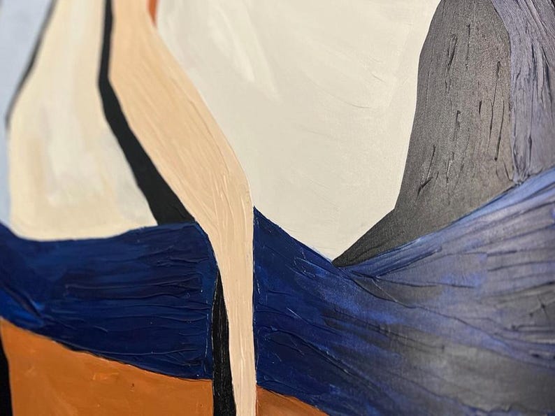 May include: Abstract painting with a textured surface. The artwork features a palette of white, navy blue, black, tan, and orange. The composition includes geometric shapes and brushstrokes, creating a modern aesthetic.