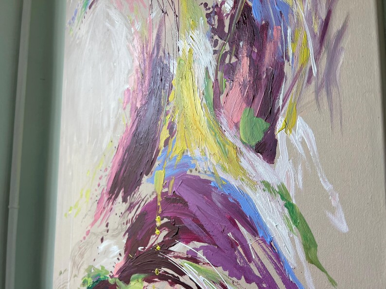May include: Abstract painting with a beige background and bold brushstrokes in shades of purple, yellow, pink, blue, and white. The artwork features a textured, expressive style with visible paint marks and drips, creating a dynamic visual effect.