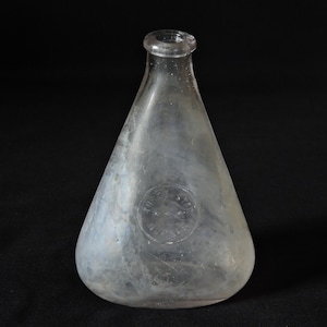 May include: A set of three ceramic nesting bowls in graduating sizes. The bowls are white with a speckled, textured finish and a slightly flared rim. The largest bowl measures approximately 8 inches in diameter.