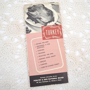 May include: A vintage pamphlet titled TURKEY featuring a black and white illustration of a roasted bird. The cover includes a list of cooking steps and the text Poultry & Egg National Board, 308 West Washington St., Chicago 6, Illinois.