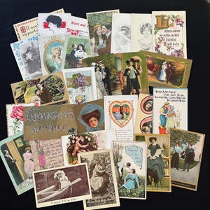 May include: A collection of vintage postcards featuring various illustrations of couples, floral designs, and romantic text. The cards display diverse artistic styles, including color lithographs and black-and-white sketches, with phrases like Thoughts of Thee and I swear I'll be true.