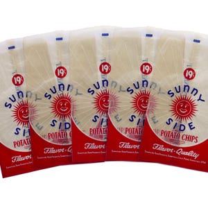 May include: Five bags of Sunny Side Potato Chips are arranged in a fan shape. Each bag has a red and white design with the words "Sunny Side Potato Chips" and a smiling sun logo. The price is marked as 19¢.