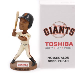 May include: A rustic wooden sign with the text "Welcome to our home" in white lettering. The sign features a distressed finish and a simple, inviting design, perfect for a front porch or entryway.