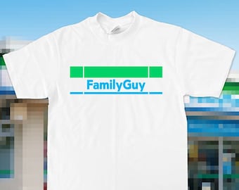 May include: White t-shirt with a green and blue graphic that says "Family Guy" on it.