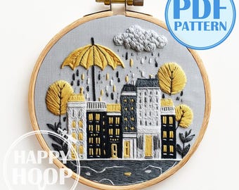 Città serale sotto la pioggia, Paesaggio urbano: Scena accogliente. Schema per ricamo a mano in PDF