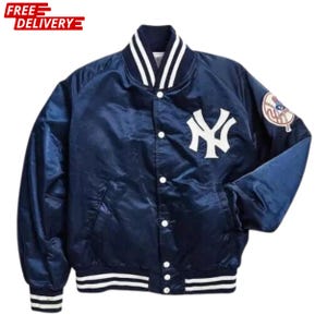 May include: A navy blue satin bomber jacket with white detailing on the collar, cuffs, and hem. It features the New York Yankees logo on the chest and a patch on the sleeve. The jacket has a button-up front.