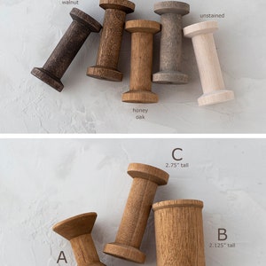 May include: Wooden spools in various wood stains, including dark walnut, aged oak, honey oak, gray wash, and unstained. The spools are different sizes, ranging from 1.25 inches to 2.75 inches tall.