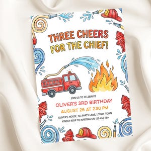 May include: A watercolor-style invitation with a fire truck, flames, and fire hoses. The text reads "THREE CHEERS FOR THE CHIEF!" and announces Oliver's 3rd birthday on August 26 at 2:30 PM. Includes address and RSVP information.