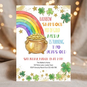 May include: A watercolor-style invitation with a rainbow, pot of gold, and shamrocks. The text reads "Rainbow, Shamrock, Pot of Gold, Avery is turning two years old." Includes event details: Saturday, March 15 at 2 PM.