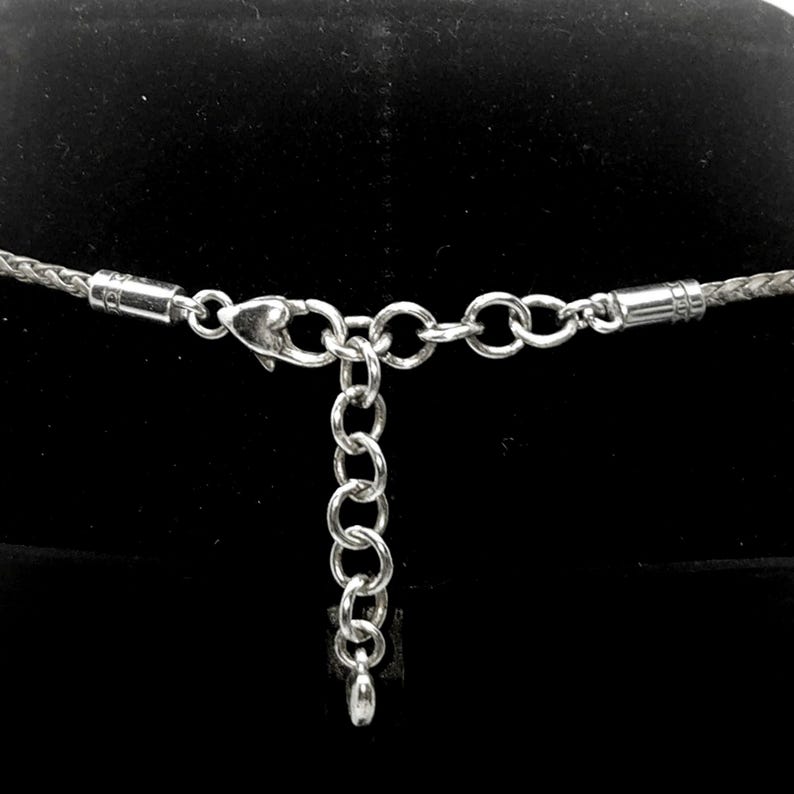 “Designed with an extender chain so you can wear it close to the neckline or a little longer.”