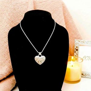 A sweet tribute to the many hats we wear. Engraved with ten roles, this heart pendant makes a thoughtful everyday keepsake.