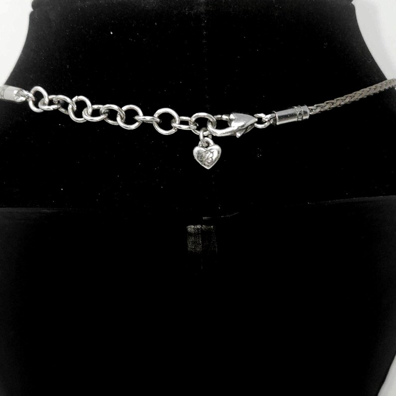 “Brighton’s signature heart charm and mixed‑chain design — a classic piece with timeless shine.”