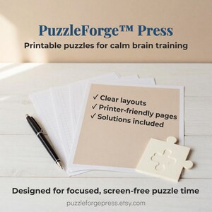 Peut inclure: Une pile de papier quadrill&eacute; blanc avec un stylo noir et une pi&egrave;ce de puzzle couleur cr&egrave;me. Le texte indique : PuzzleForge Press, Printable puzzles for calm brain training, Clear layouts, Printer-friendly pages, Solutions included, Designed for focused, screen-free puzzle time, puzzleforgepress.etsy.com.