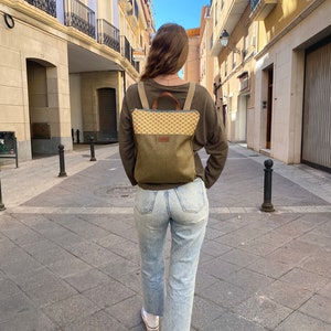 girl with a minimalist mustard backpack