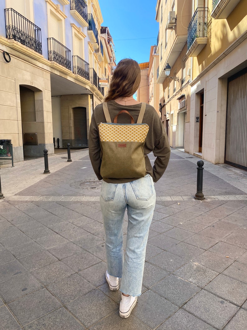 girl with a minimalist mustard backpack
