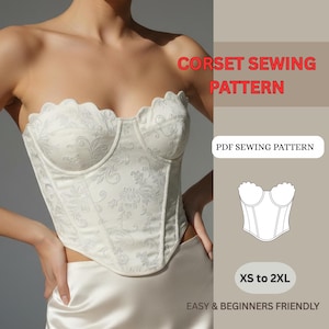 May include: Ivory-colored corset with a floral pattern and scalloped neckline. The image includes text that reads "CORSET SEWING PATTERN", "PDF SEWING PATTERN", "XS to 2XL", and "EASY & BEGINNERS FRIENDLY".