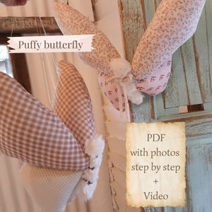 Pode incluir: Close-up de duas decorações de borboletas fofas. Uma borboleta tem asas xadrez marrons e brancas, a outra tem asas florais rosa. O texto "Puffy butterfly" é visível. Um PDF com fotos e um vídeo também é anunciado.