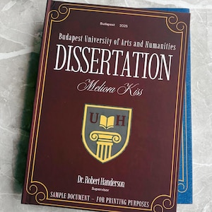 May include: A maroon dissertation book with gold detailing and the word "DISSERTATION" is visible. The cover features the Budapest University of Arts and Humanities logo and the name "Meliora Kiss." The text "PERSONALIZED DISSERTATION & THESIS DESIGN & PRINTING" is at the top.