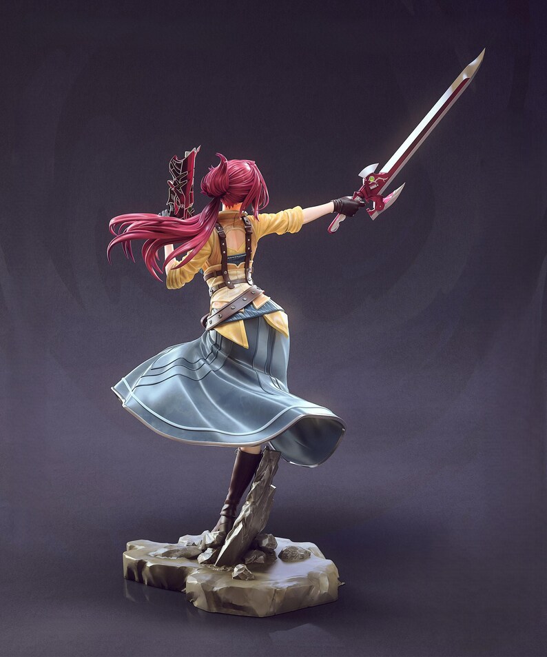May include: A detailed figurine of a character in a dynamic pose, holding a sword and a weapon. The figure has long, flowing red hair and is dressed in a yellow top, blue skirt, and brown boots. The base is a rocky structure.