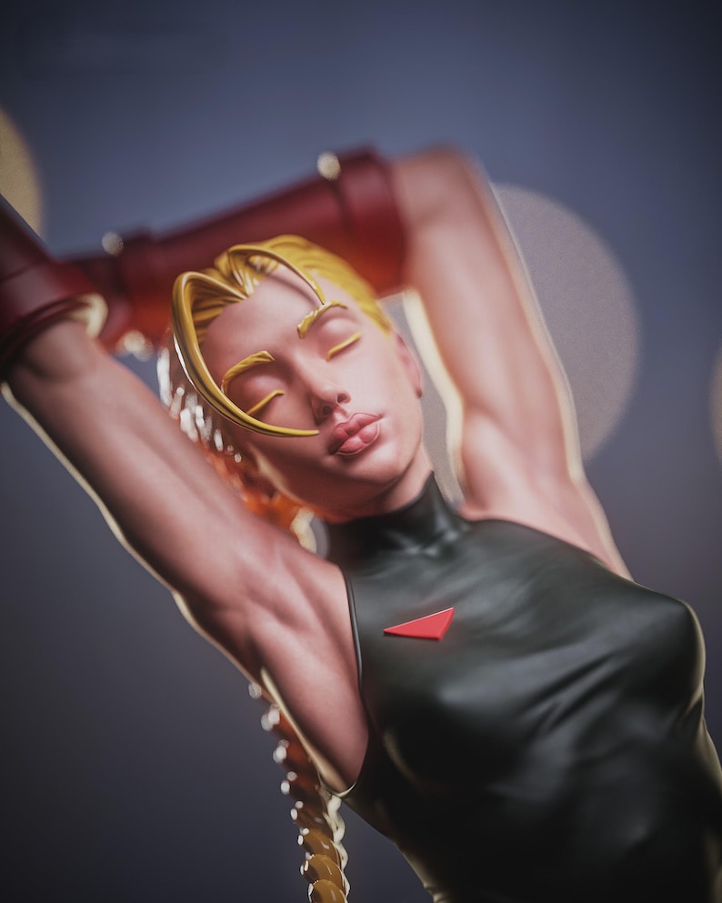 May include: A detailed figurine of a character with blonde hair styled in a braid and a distinctive headpiece. The figure wears a black outfit with a red triangle accent. Red armbands are visible. The figure is posed with arms raised.