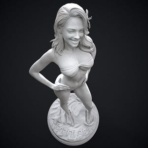 May include: A grayscale sculpture of a woman in a bikini, standing on a circular base. The base has the words "bikini girl" and a starfish design. The woman is smiling and has her hand on her hip.