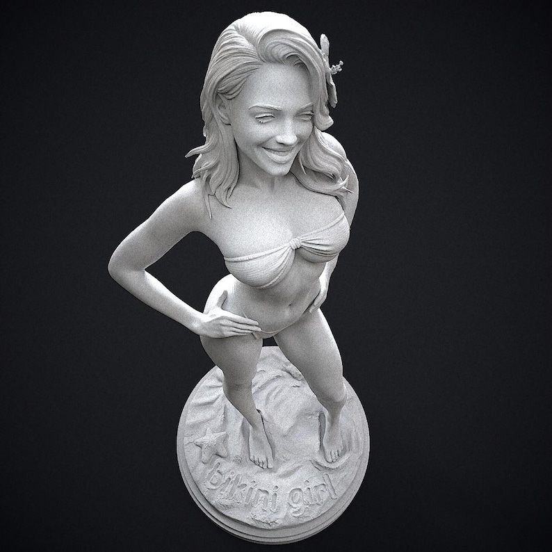 May include: A grayscale sculpture of a woman in a bikini, standing on a circular base. The base has the words "bikini girl" and a starfish design. The woman is smiling and has her hand on her hip.