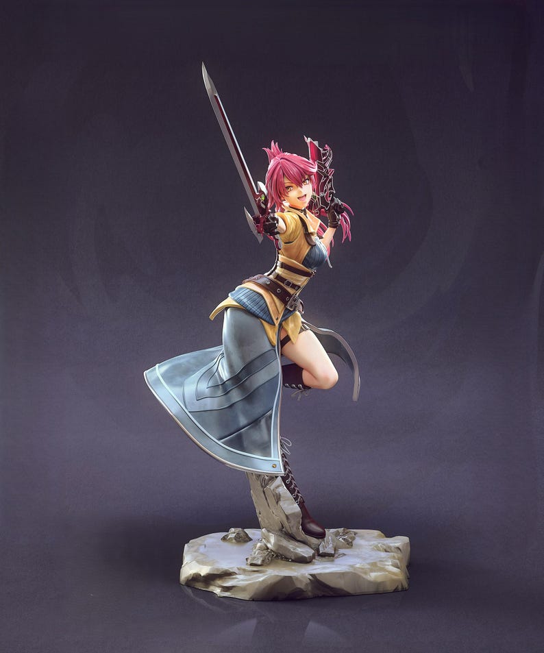 May include: A detailed figurine of a female warrior in a dynamic pose, holding a sword. The figure has pink hair, a yellow and blue outfit, and is standing on a rocky base. The sword is silver with a red accent.