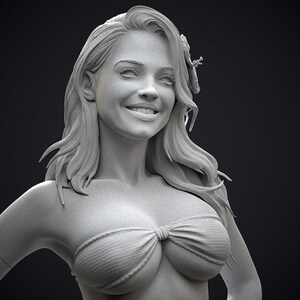 May include: A grayscale sculpture of a smiling woman with long, flowing hair and a flower in her hair. She is wearing a bikini top. The sculpture is detailed and realistic, with a focus on the woman's facial features and expression.