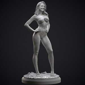 May include: A gray 3D-printed sculpture of a woman in a bikini, standing with her hands on her hips. The sculpture is on a round base with a textured surface, and the background is dark.