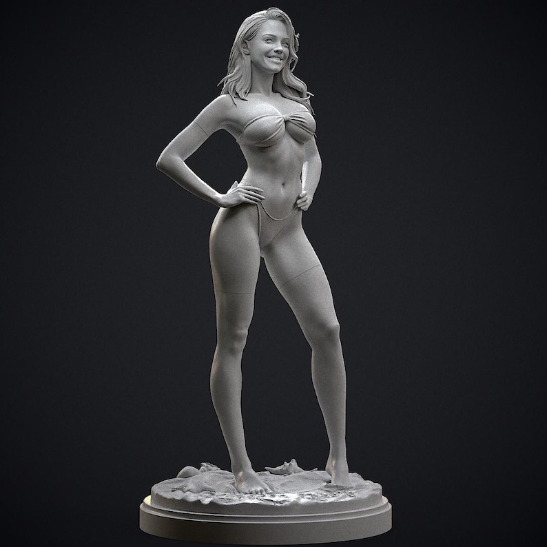 May include: A gray 3D-printed sculpture of a woman in a bikini, standing with her hands on her hips. The sculpture is on a round base with a textured surface, and the background is dark.