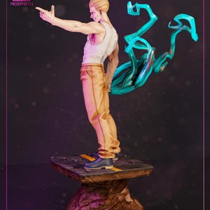 May include: A figurine of a male character in a white tank top and tan pants, with a dynamic pose and flowing teal energy effect. The figure stands on a textured base with yellow stripes. The image includes the text "HIGH-QUALITY" and "PRESUPPORTED".