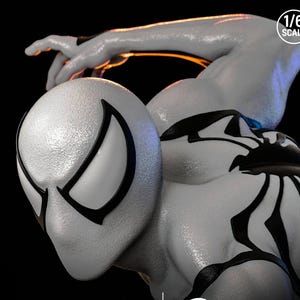 May include: A detailed, close-up of a white and black action figure. The figure is in a dynamic pose, with the text "1/6 SCALE" in the upper right corner. The figure has a textured surface and black accents.