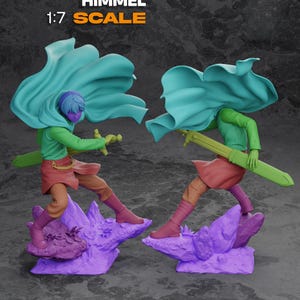 May include: Two action figures in dynamic poses, each with a teal cape, green shirt, and brown pants. They stand on purple rock formations, holding swords. The text "HIMMEL" and "1:7 SCALE" are displayed in orange.