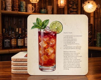 May include: A square drink coaster featuring a printed illustration of a Shark's Tooth cocktail in a tall glass with ice, a lime slice, and mint leaves. The text lists ingredients including Barbados rum, lime juice, pineapple juice, simple syrup, cherry syrup, and Jamaican rum, along with preparation instructions.