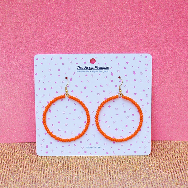 Bright Orange Seed Bead Hoop Earrings by The Fuzzy Pineapple Dangle Drop Bohemian Vibrant Light Orange Glass Beaded Hoop Earring