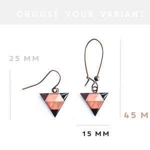 May include: Two pairs of geometric triangle earrings with a black, pink, and brown pattern. The smaller earrings are 2.5 cm long and the larger earrings are 4.5 cm long.