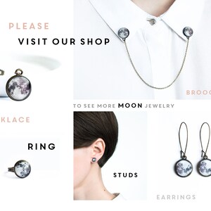 May include: An assortment of moon-themed jewelry, including a necklace, brooches, ring, studs, and earrings. The jewelry features a circular design with a detailed moon image. The text "PLEASE VISIT OUR SHOP" is also visible.