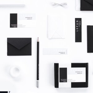 May include: A flat lay featuring minimalist jewelry branding materials. The composition includes black and white business cards, envelopes, a pencil, and a small box. The brand name "LEPUN" is prominently displayed, along with social media handles and email.
