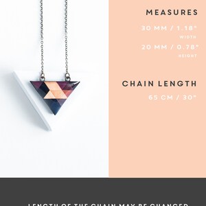May include: A geometric pendant necklace with a triangular pendant. The pendant is made of wood and features a mosaic design in shades of brown, black, and peach. The chain is 30 inches long. The pendant measures 1.18 inches wide and 0.78 inches high. The text says "LENGTH OF THE CHAIN MAY BE CHANGED."