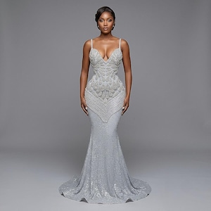 rhinestone mermaid wedding dress C2022-FF787 - off the shoulder fit-to-flare gown with swarovski crystal beading and ruffle tulle skirt A rhinestone mermaid wedding dress with sheer high neck and long sleeves Mermaid-Style Wedding Dresses | Mermaid